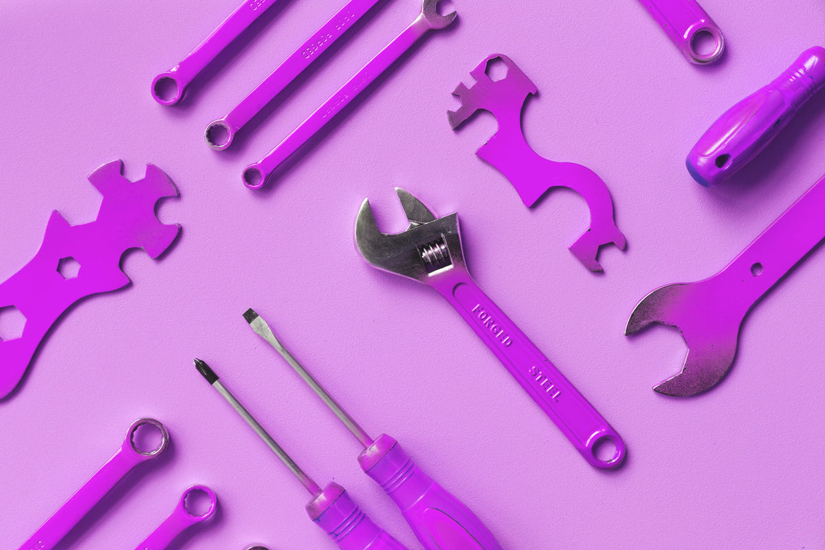 Purple hand tools arranged on a purple background. Photo by Sarah Pflug, Burst by Shopify.